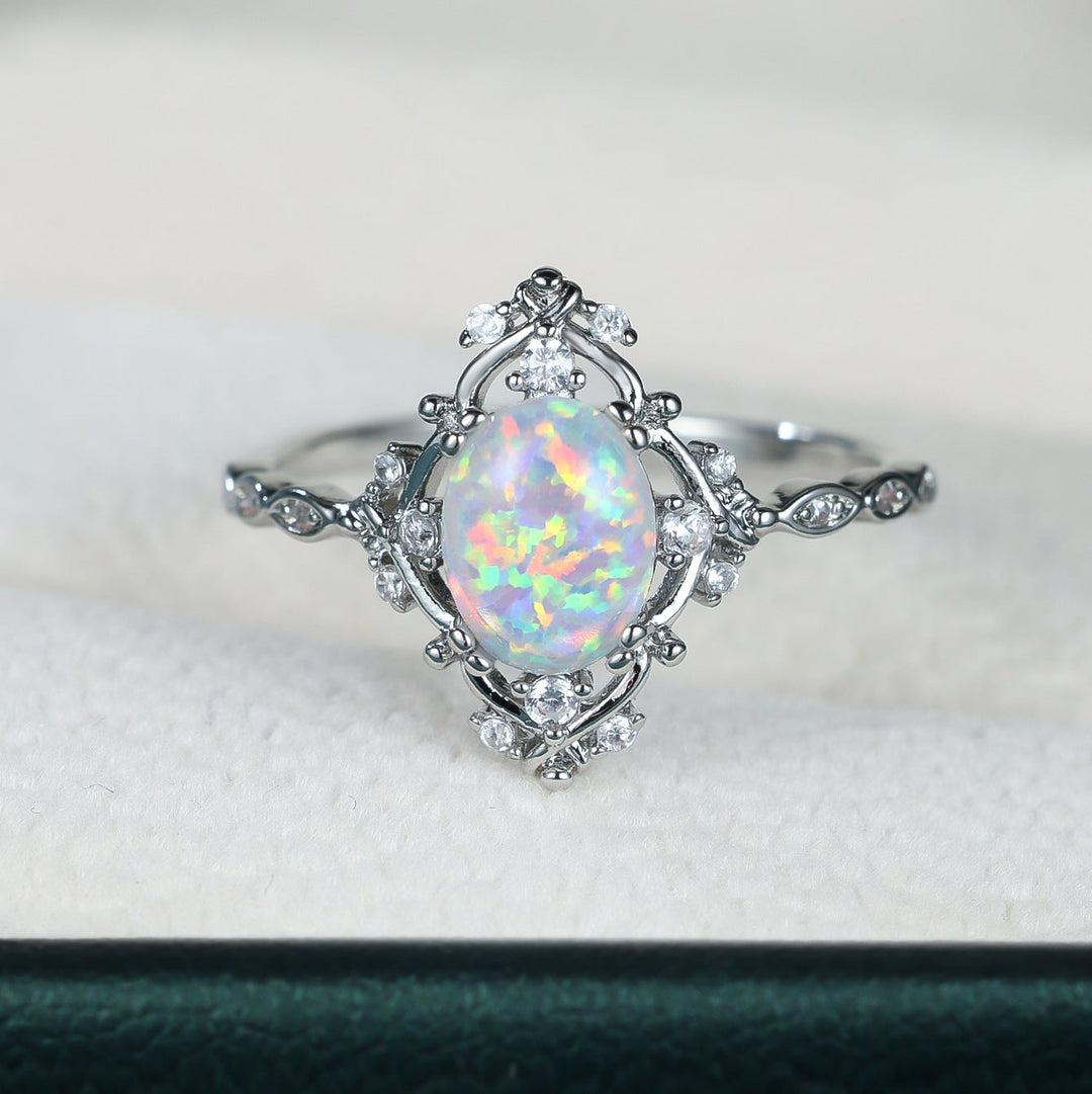 Oval Opal and Zircon Halo Everyday Ring