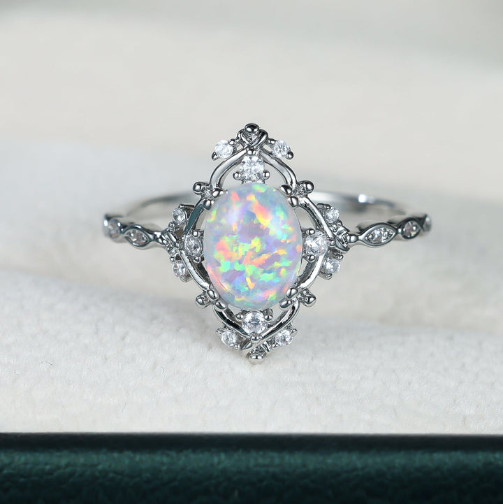Oval Opal and Zircon Halo Everyday Ring